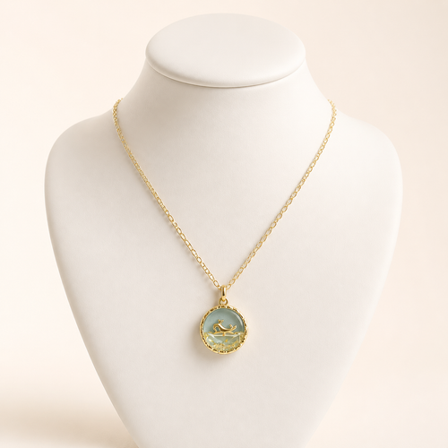 Gold mermaid tail resin pendant on a fine gold chain