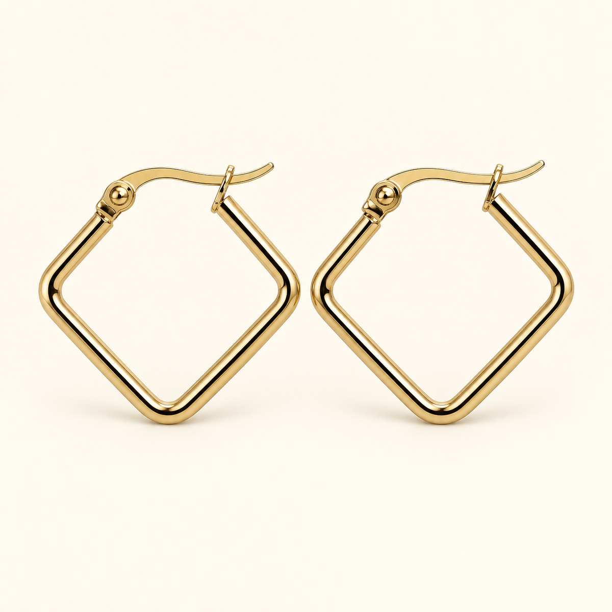 Diamond-shaped hoop earrings in gold tone