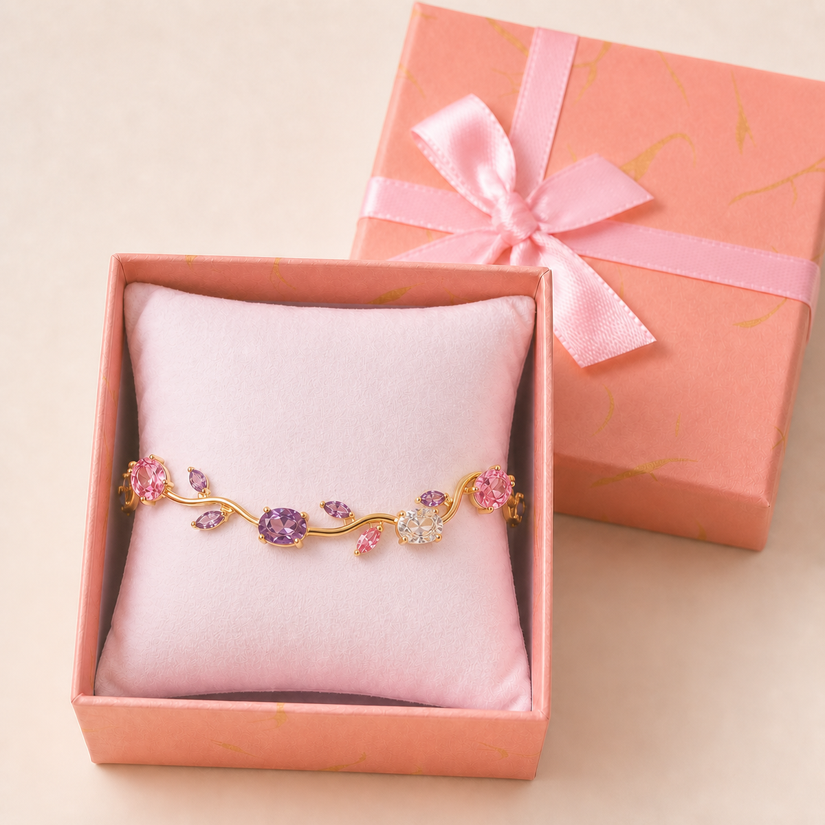 Multicolour Tulip Bracelet in an open blush-pink gift box — worn around the cushion