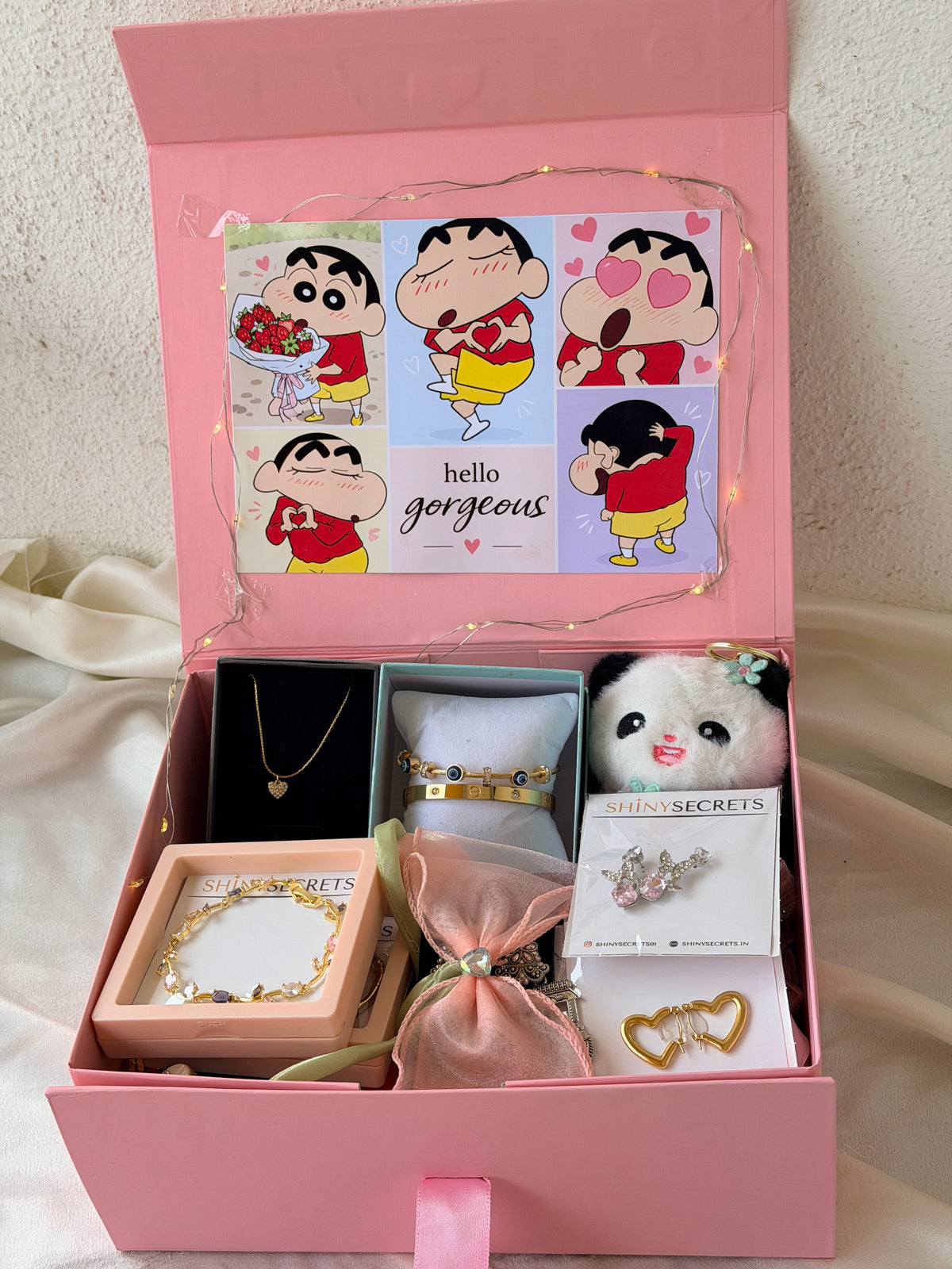 Original detail view of the jewellery, bracelets and panda keychain